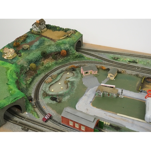 31 - Model railway N gauge track layout and various accessories to include Graham Farish locomotive 78
