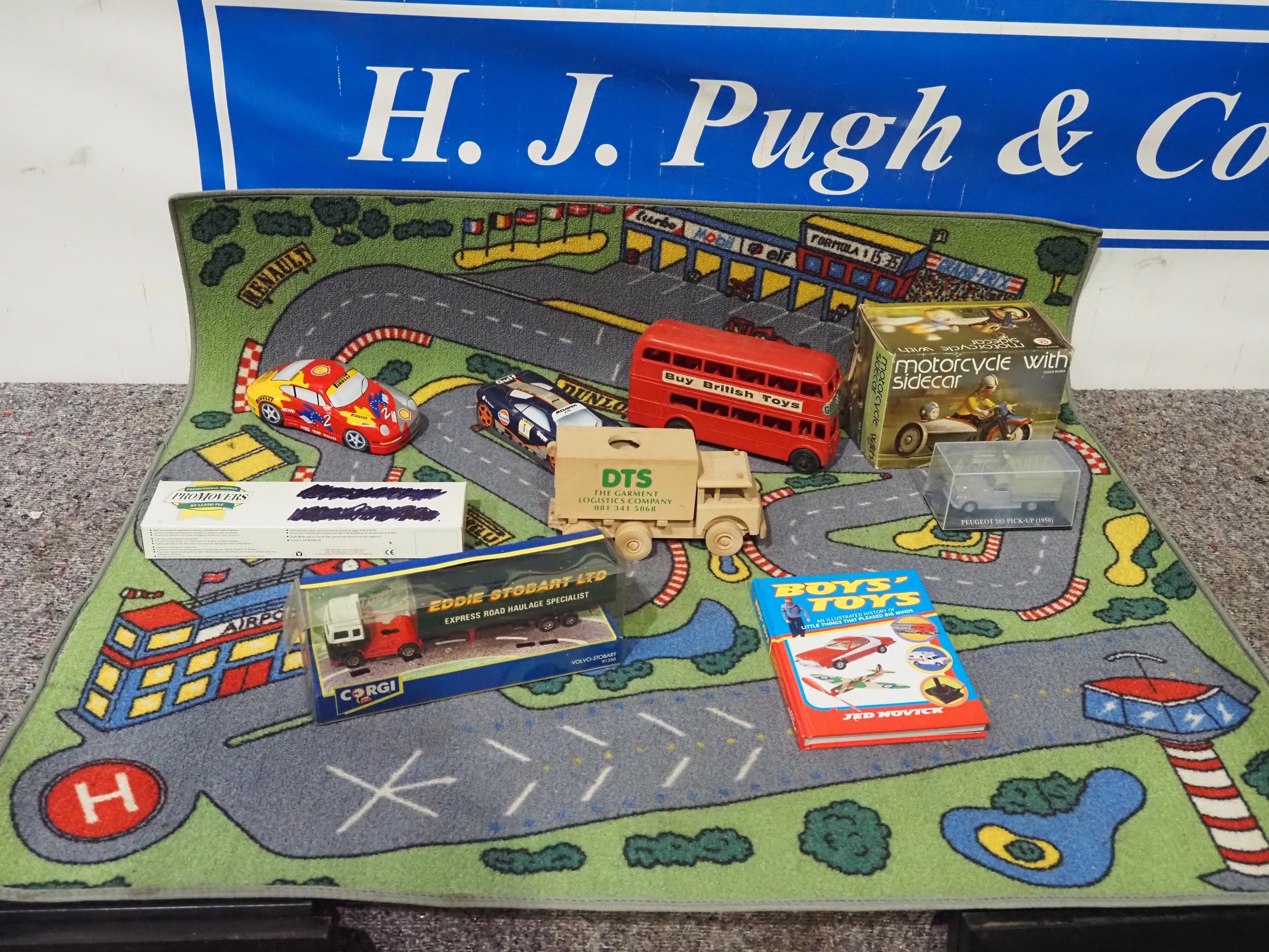 Race track playmat and assorted model vehicles to include boxed ...