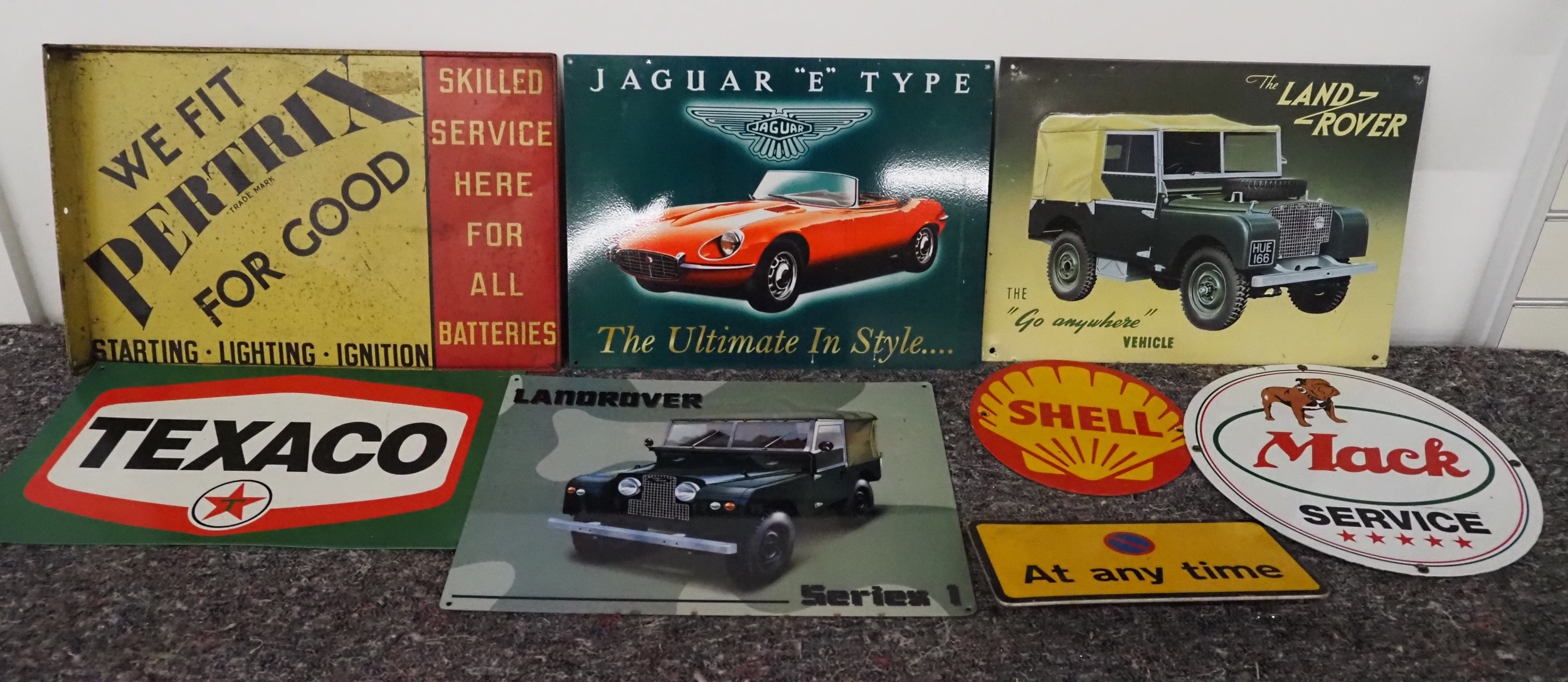 Assorted tin signs to include Texaco, Pertrix, Land Rover, etc.