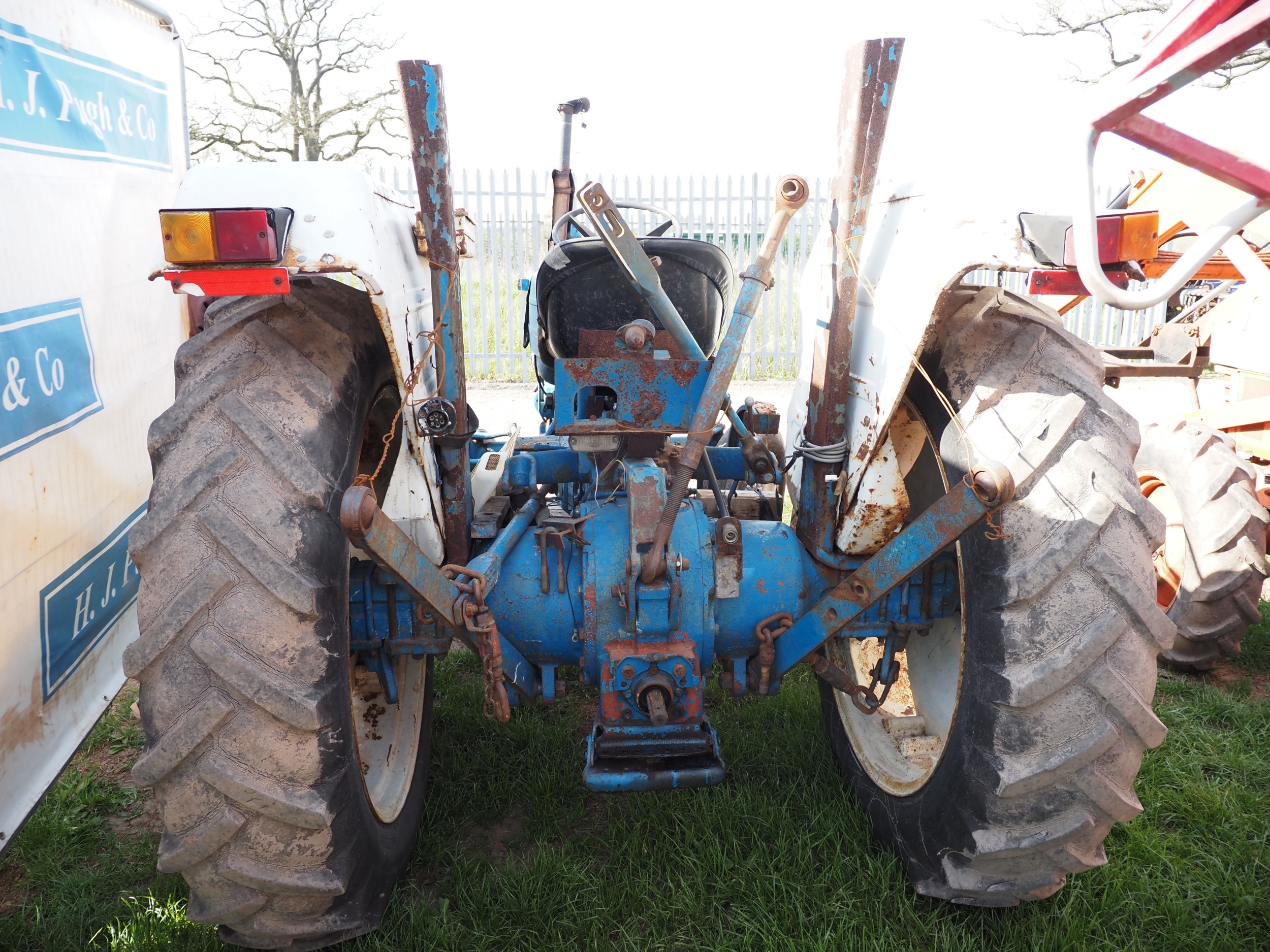 Ford 4600 tractor with front inside wheel weights. Runs and drives