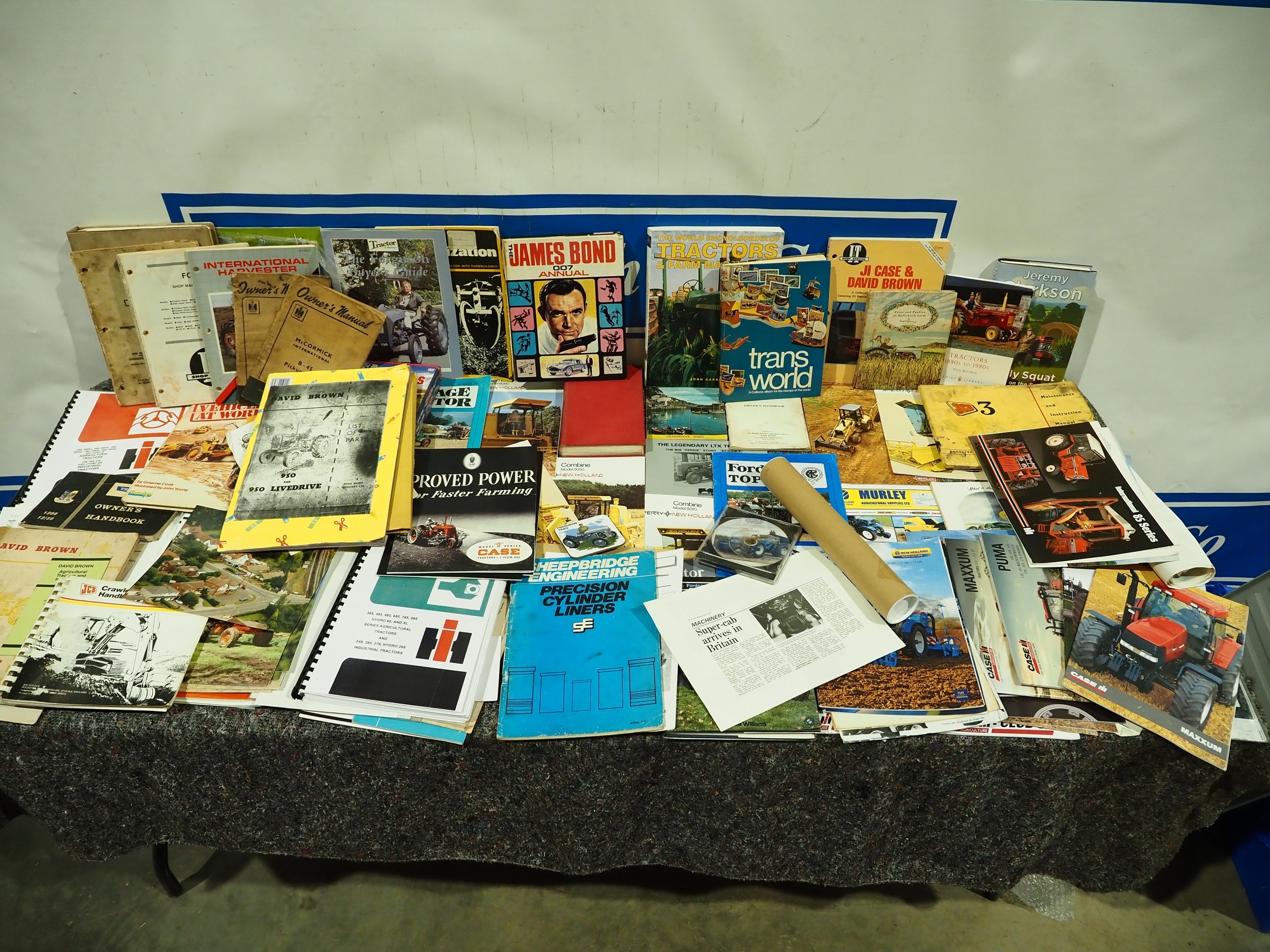 Various tractor sales brochures, hard back books, instruction manuals etc