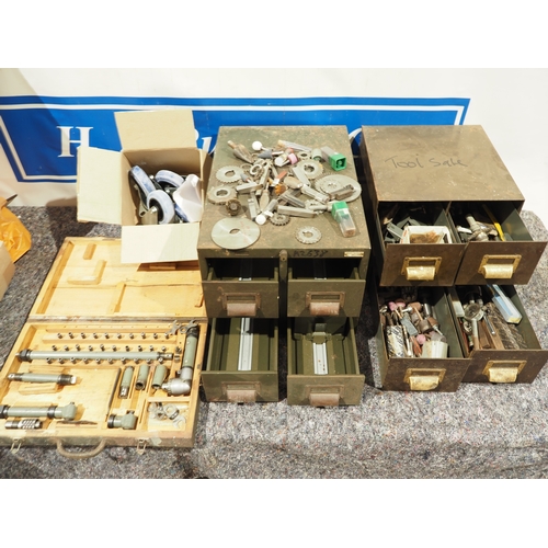 211 - Metal indexing drawers, assorted taps, dies, milling cutters, heavy duty casters and angle drilling ... 