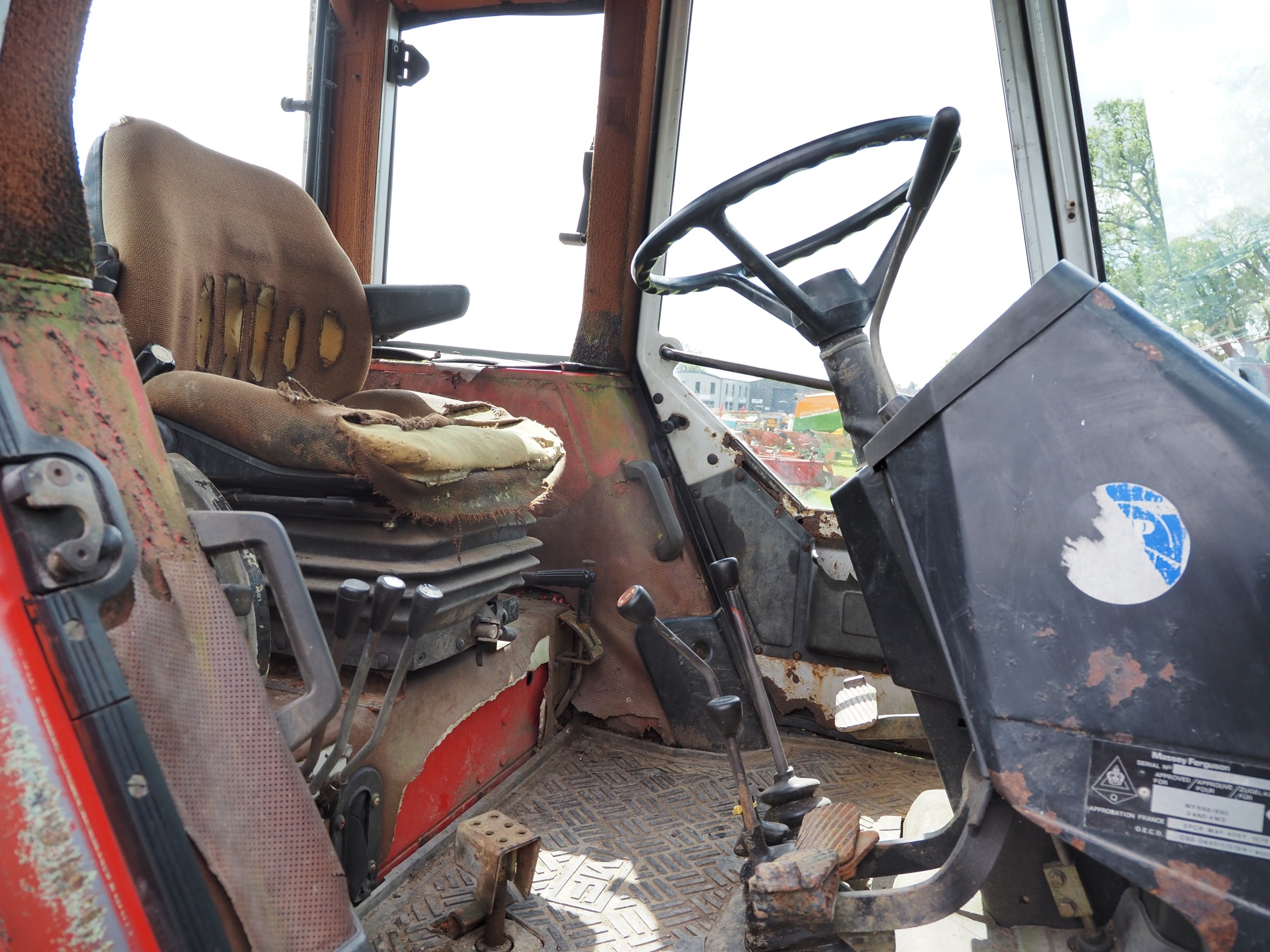 Massey Ferguson 690 tractor with front loader. Runs and drives. Showing ...