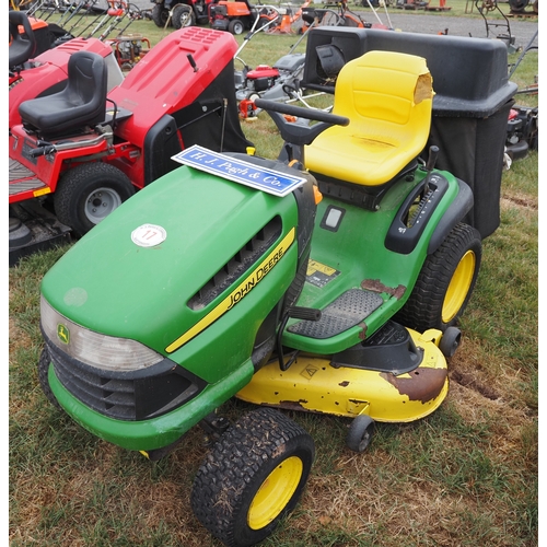 17 - John Deere X140 ride on mower runs and drives. Key in office