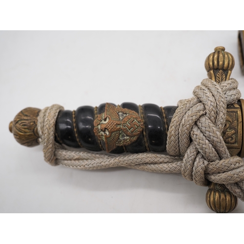 24 - WW2 German Kriegsmarine Officer's Dress Dagger. With a wire wrapped grip with Eagle & Swastika insig... 