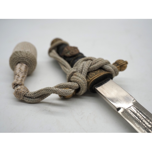 24 - WW2 German Kriegsmarine Officer's Dress Dagger. With a wire wrapped grip with Eagle & Swastika insig... 
