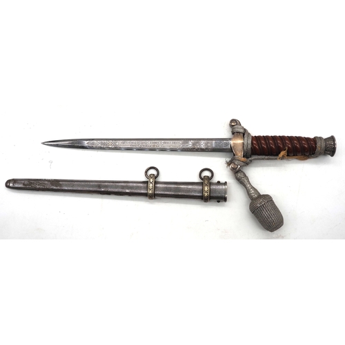26 - WW2 German Officer's Dress Dagger. With an Red grip & wire wrap. Features detailed pommel & cross gu... 