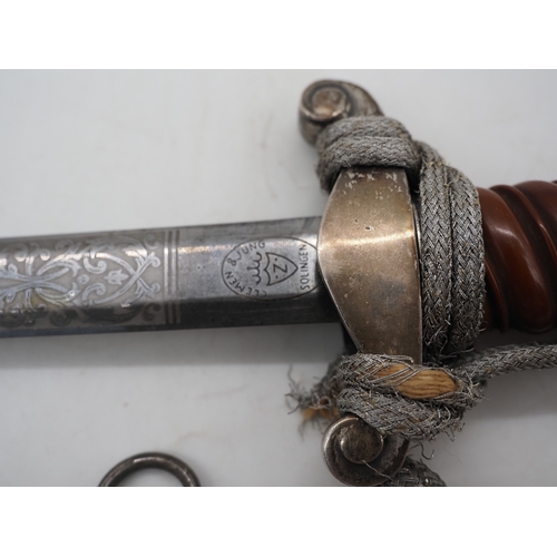 26 - WW2 German Officer's Dress Dagger. With an Red grip & wire wrap. Features detailed pommel & cross gu... 