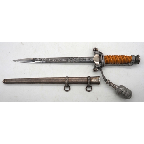 27 - WW2 German Officers Dress Dagger. With orange celluloid type grip. Detailed pommel with Eagle & Swas... 