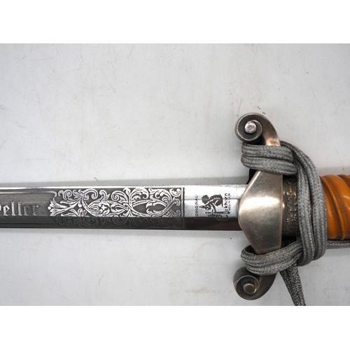 27 - WW2 German Officers Dress Dagger. With orange celluloid type grip. Detailed pommel with Eagle & Swas... 