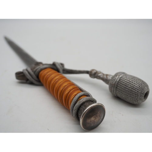 27 - WW2 German Officers Dress Dagger. With orange celluloid type grip. Detailed pommel with Eagle & Swas... 