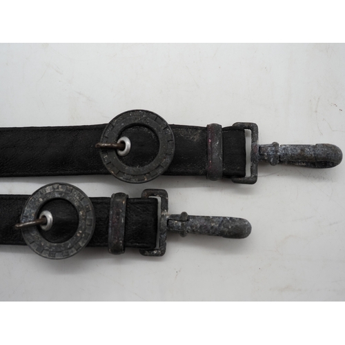 29 - Pair of  Third Reich Teno Officers Dagger Hangers. In black leather with a zinc cogwheel & clips.