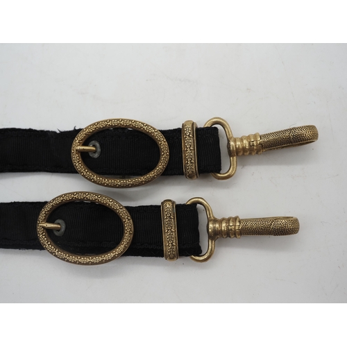 32 - WW2 German Kriegsmarine Officers Dagger Hangers. Black velvet hangers with decorative oval buckles a... 