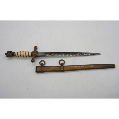 38 - WW2 German Officer's Kriegsmarine Dress Dagger. Featuring a wire bound celluloid grip with eagle and... 