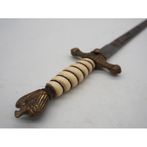 38 - WW2 German Officer's Kriegsmarine Dress Dagger. Featuring a wire bound celluloid grip with eagle and... 