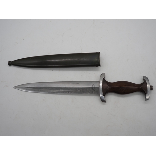 39 - German Third Reich Student Dagger. With a wooden grip and eagle and Swastika emblem complete with me... 