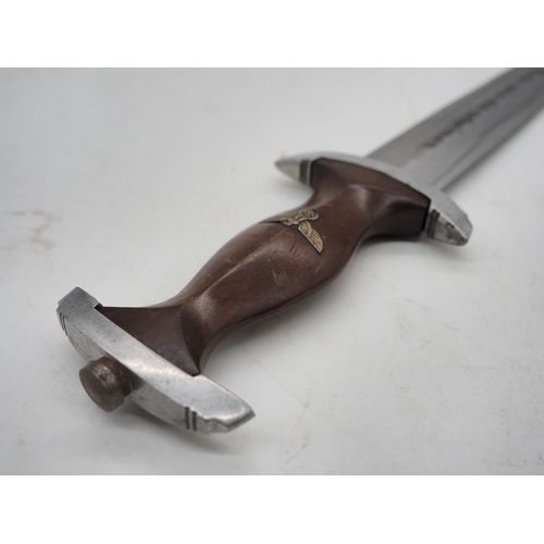 39 - German Third Reich Student Dagger. With a wooden grip and eagle and Swastika emblem complete with me... 