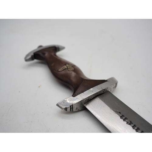39 - German Third Reich Student Dagger. With a wooden grip and eagle and Swastika emblem complete with me... 