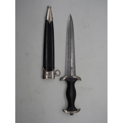 41 - WW2 German SS M33 Service Dagger. With black grip featuring eagle and Swastika and SS emblem, compet... 