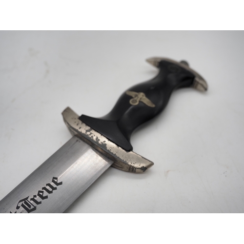 41 - WW2 German SS M33 Service Dagger. With black grip featuring eagle and Swastika and SS emblem, compet... 