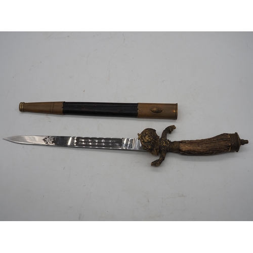 42 - German Hunting Dagger With Antler Horn Grip. Featuring a decorative pommel and cross guard with dog ... 