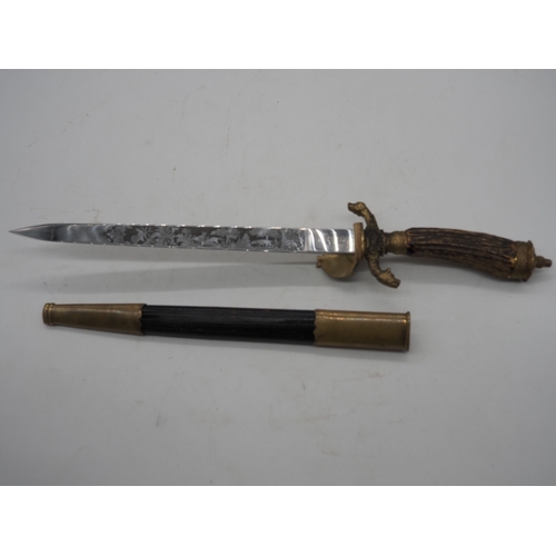 42 - German Hunting Dagger With Antler Horn Grip. Featuring a decorative pommel and cross guard with dog ... 