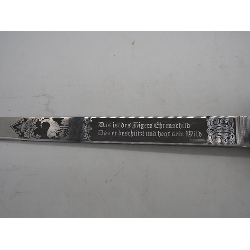 42 - German Hunting Dagger With Antler Horn Grip. Featuring a decorative pommel and cross guard with dog ... 