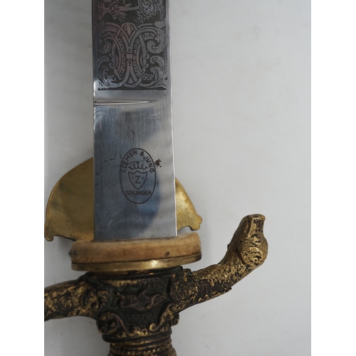 42 - German Hunting Dagger With Antler Horn Grip. Featuring a decorative pommel and cross guard with dog ... 
