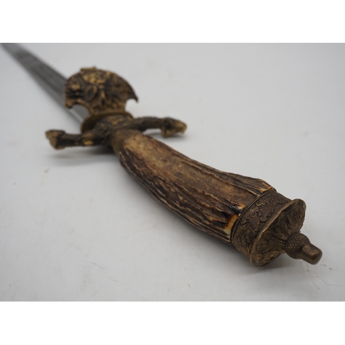 42 - German Hunting Dagger With Antler Horn Grip. Featuring a decorative pommel and cross guard with dog ... 
