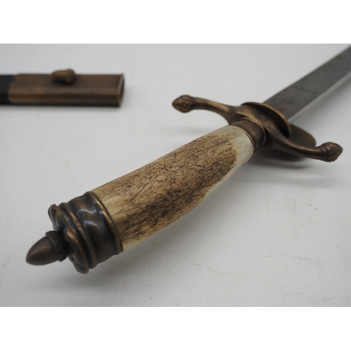 43 - German Hunting Dagger With Decorative Bone Grip Featuring a Brass Insignia of Crossed Rifles. Decora... 
