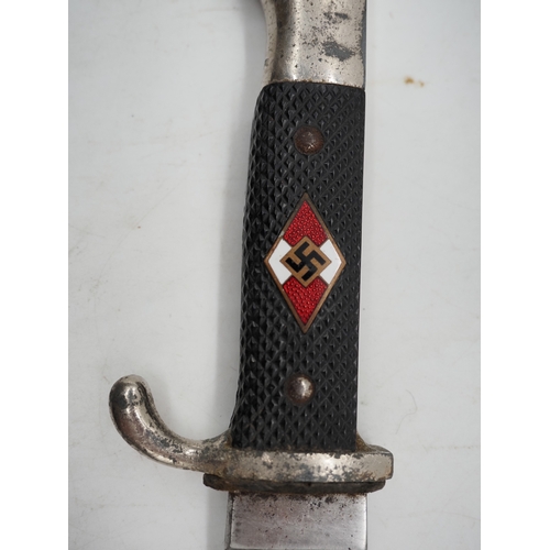 44 - German Hitler Youth Knife. With a black chequered textured grip featuring the diamond Swastika emble... 