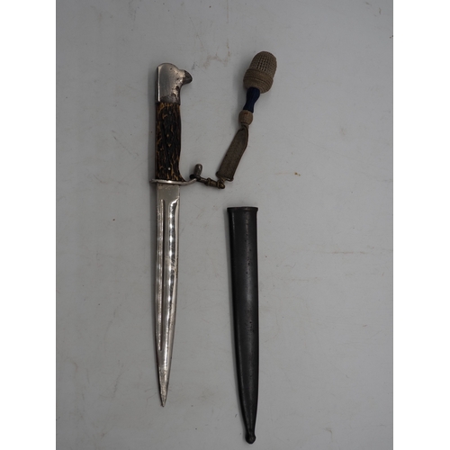 47 - German Officer's Trench Dagger. With a bone grip, complete with metal scabbard depicting Cologne Cat... 