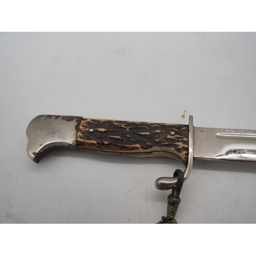 47 - German Officer's Trench Dagger. With a bone grip, complete with metal scabbard depicting Cologne Cat... 