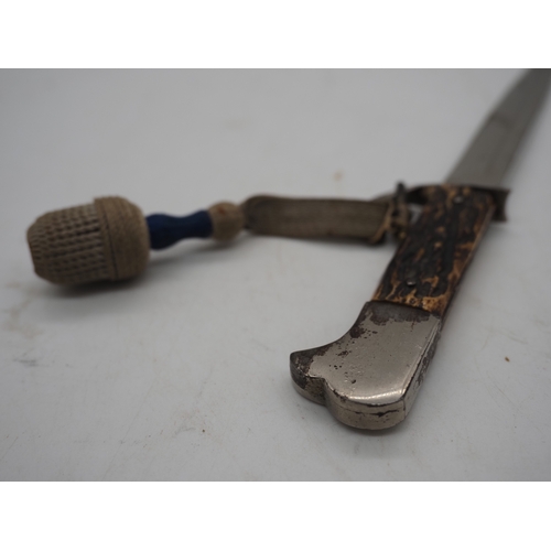 47 - German Officer's Trench Dagger. With a bone grip, complete with metal scabbard depicting Cologne Cat... 