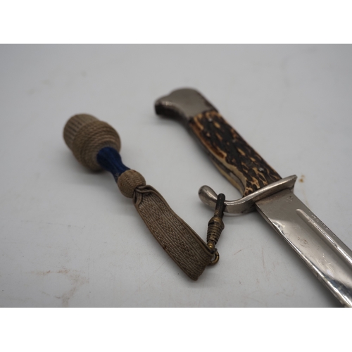 47 - German Officer's Trench Dagger. With a bone grip, complete with metal scabbard depicting Cologne Cat... 