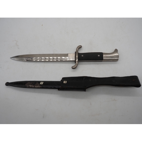 48 - WW2 German Fireman's Dress Bayonet. With a black chequered textured grip, hooked pommel and forward ... 