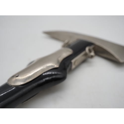 51 - German Ceremonial Fire Brigade Dress Axe. Featuring a polished head and black medal handle with 2 ha... 