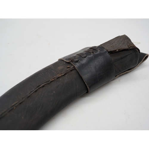 53 - Nepalese Ghurkha Knife. With a dark wooden grip, single edged blade complete with leather scabbard w... 