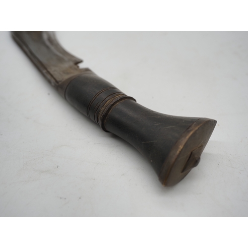 53 - Nepalese Ghurkha Knife. With a dark wooden grip, single edged blade complete with leather scabbard w... 