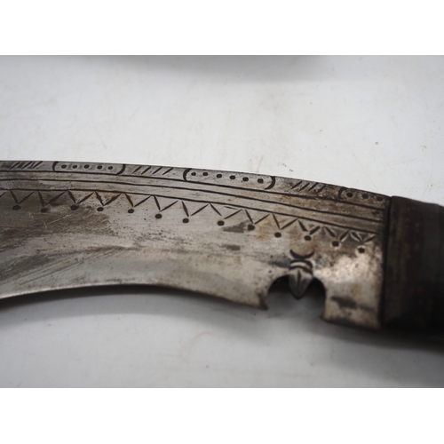 54 - Nepalese Ghurkha Knife. Carved wooden handle complete with carved wooden scabbard and single edged d... 