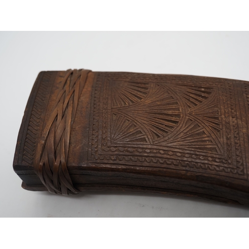 54 - Nepalese Ghurkha Knife. Carved wooden handle complete with carved wooden scabbard and single edged d... 