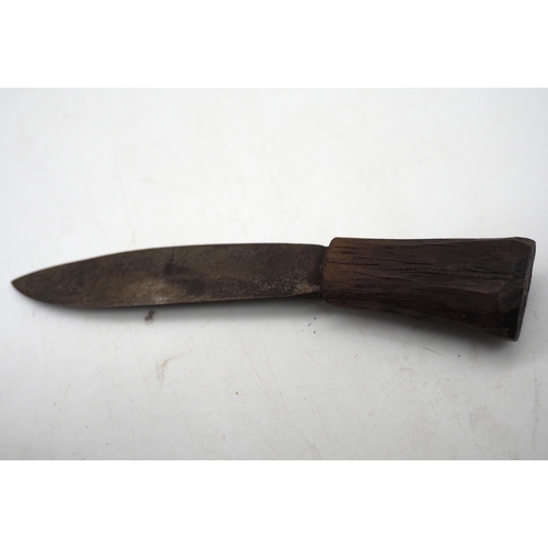 54 - Nepalese Ghurkha Knife. Carved wooden handle complete with carved wooden scabbard and single edged d... 