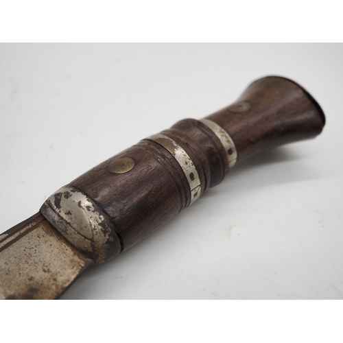 55 - Nepalese Ghurkha Knife. Ornate wooden and metal handle, complete with leather scabbard, single edged... 