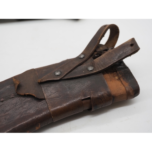 56 - Nepalese Ghurkha Knife. Polished black wooden handle with brass pommel and complete with leather sca... 