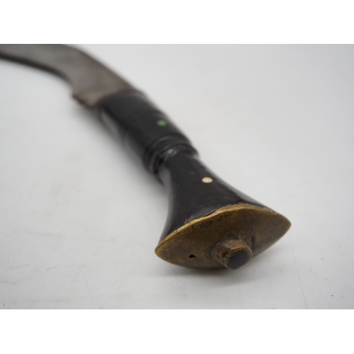 56 - Nepalese Ghurkha Knife. Polished black wooden handle with brass pommel and complete with leather sca... 