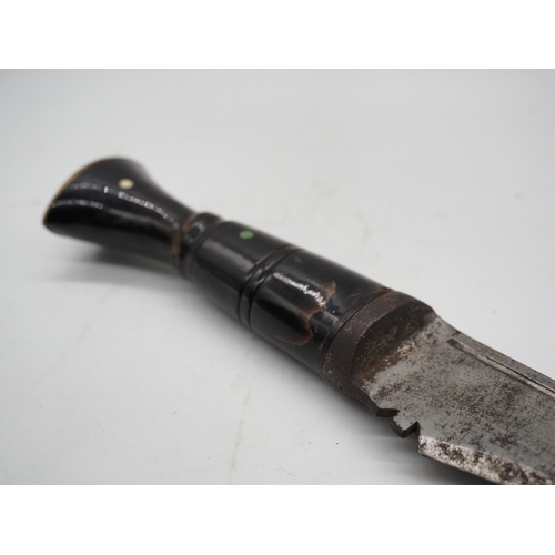 56 - Nepalese Ghurkha Knife. Polished black wooden handle with brass pommel and complete with leather sca... 