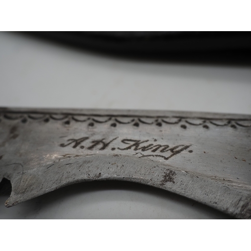 57 - Ghurkha Knife With a Bone Handle Grip. Complete with a leather scabbard with a single edged decorati... 