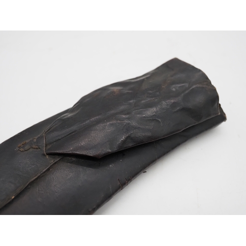 57 - Ghurkha Knife With a Bone Handle Grip. Complete with a leather scabbard with a single edged decorati... 