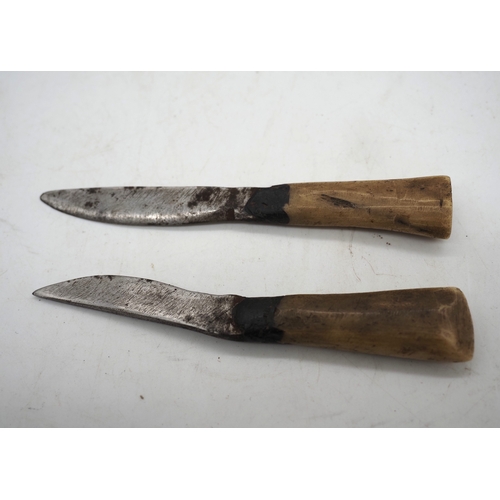 57 - Ghurkha Knife With a Bone Handle Grip. Complete with a leather scabbard with a single edged decorati... 