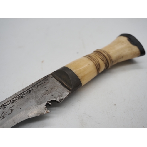 57 - Ghurkha Knife With a Bone Handle Grip. Complete with a leather scabbard with a single edged decorati... 